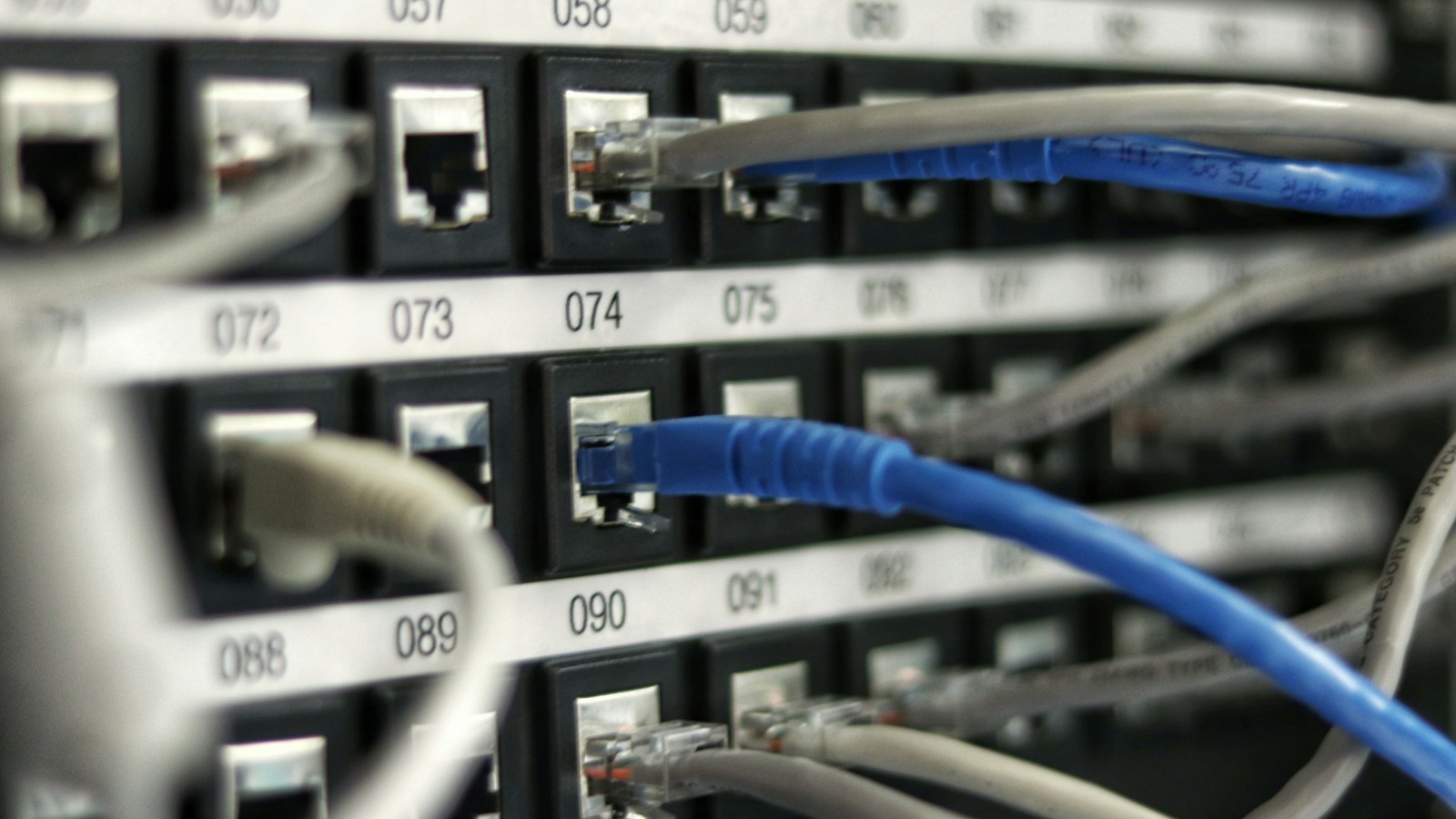 High-density server rack power distribution units and cables measuring home lab electricity draw and 24/7 AI cluster operating costs