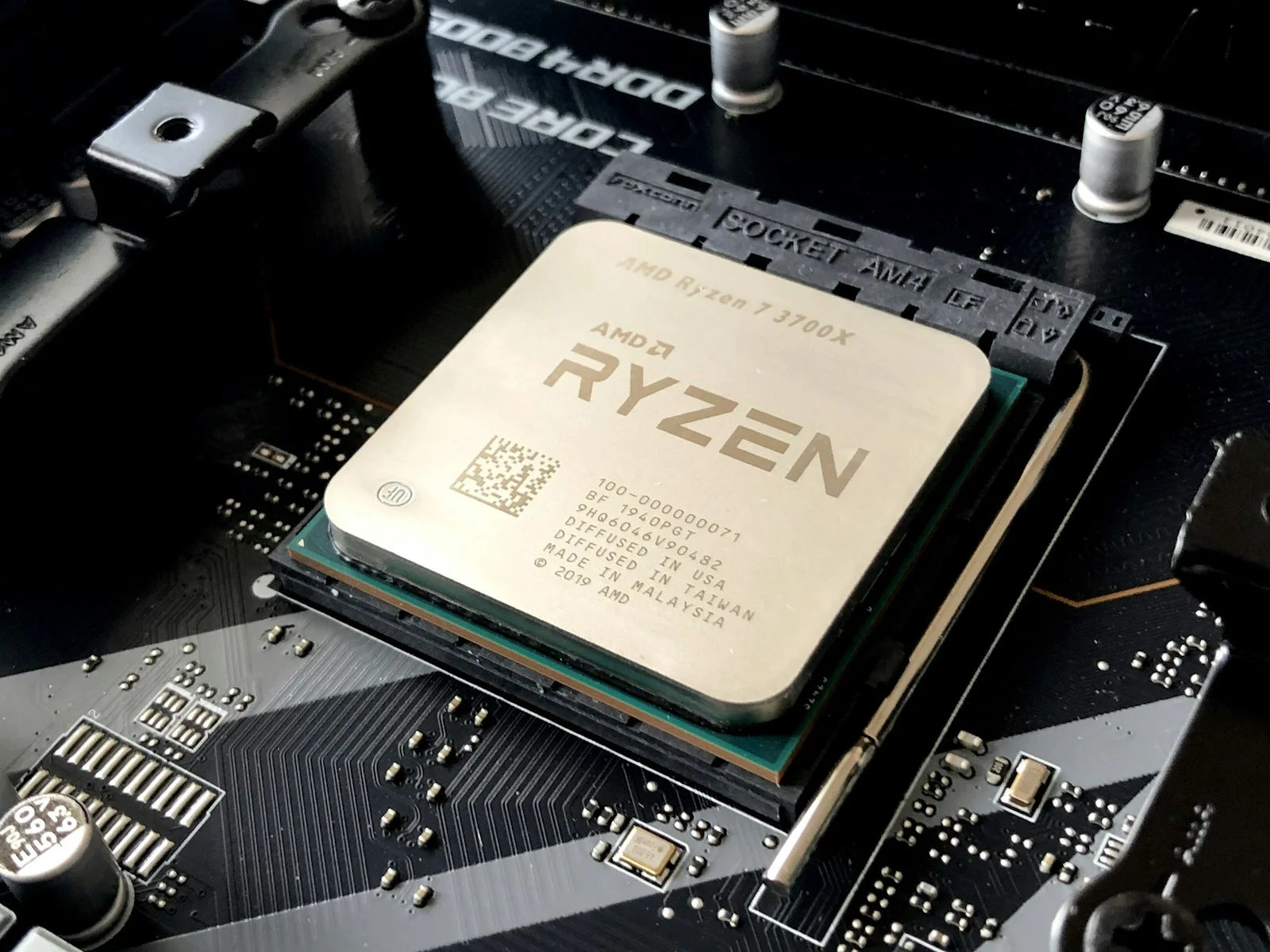 AMD Ryzen AM5 processor installed on high-end gaming motherboard with thermal cooling